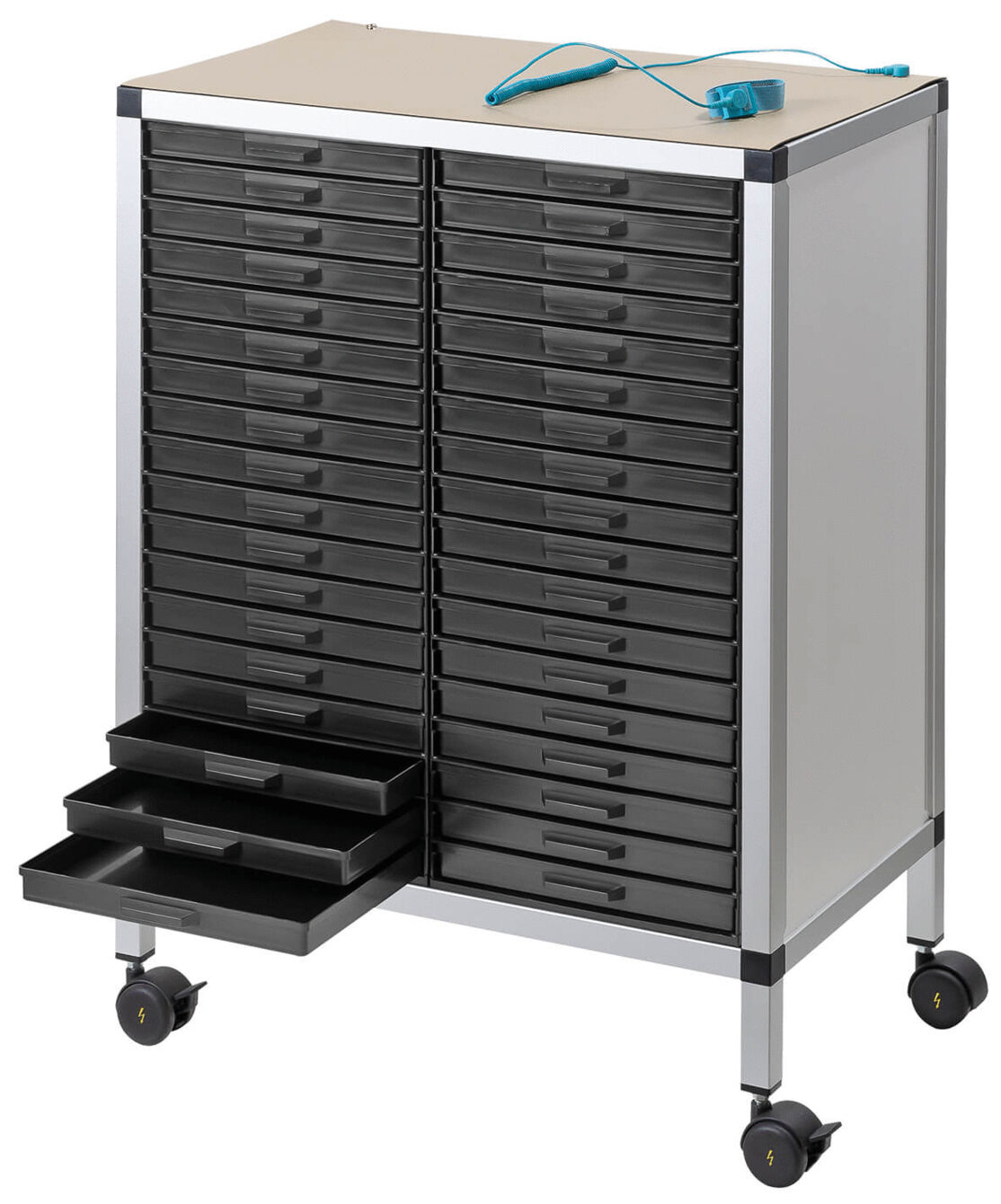 The image shows a rolling storage cabinet with several black drawers. On top, there is a flat, light-colored shelf and a blue object. The cabinet has four wheels.