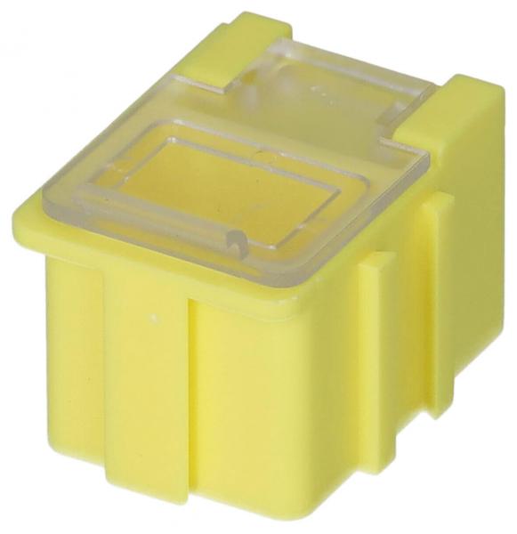 The image shows a compact, yellow box. It has a square shape with rounded corners and a transparent top. There are vertical grooves on the sides.