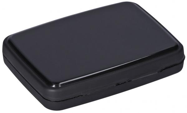 The image shows a rectangular, flat box in black with sharp edges. It has a smooth lid and presumably a hinged opening on one side.