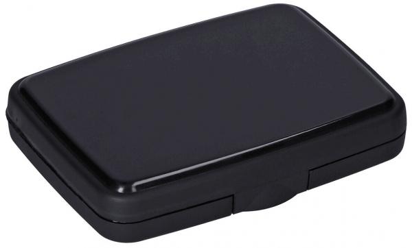 The image shows a rectangular, flat box in matte black. It has rounded edges and a simple, inconspicuous lid that is easy to open.