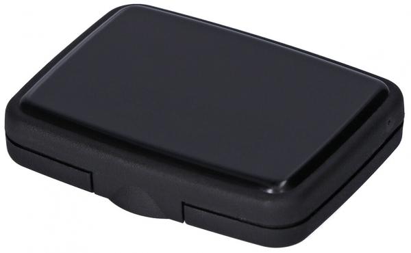 The image shows a black, rectangular case. It has rounded corners, a smooth surface, and a small scored edge in the middle that can be opened. It appears simple and compact.