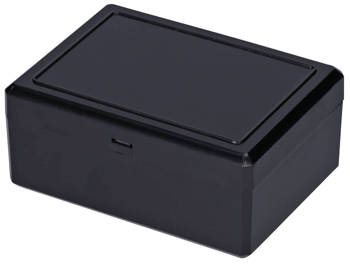 It is a rectangular, black box with a flat lid. The surface is smooth and glossy, the edges are slightly rounded. It has a simple, practical shape.