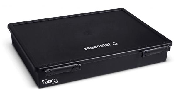 The image shows a rectangular, flat storage box in matte black. The box has a lid and two side clips for closing. The brand name "raaco" is displayed on the top.