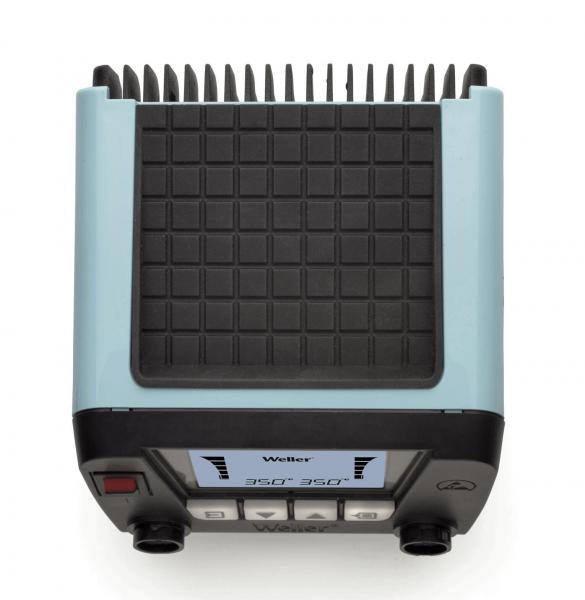 The image shows a compact, rectangular device in light blue and black. The top features a grid-like structure with many small bumps. Below, there are buttons and a display.