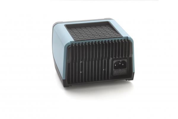 The image depicts a compact, square device with a smooth, blue top and a ridged back. A socket is visible on the bottom. It appears modern and functional.