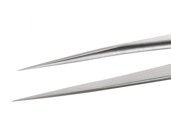 The image shows a pair of scissors with two sharp, pointed metal blades. The blades are long and narrow, and the material has a shiny, silver hue.