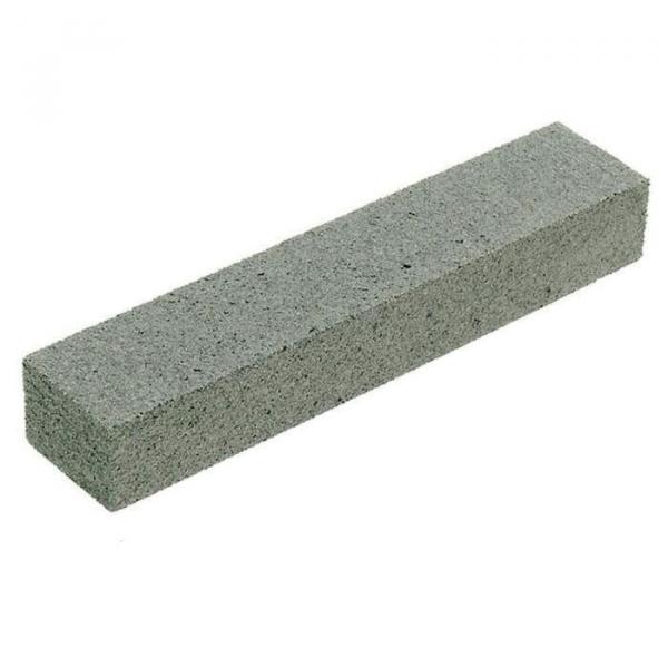 The image shows a gray wooden block in a rectangular shape. It has a rough surface and is flat with rounded edges. The dimensions are approximately twice as long as they are wide.