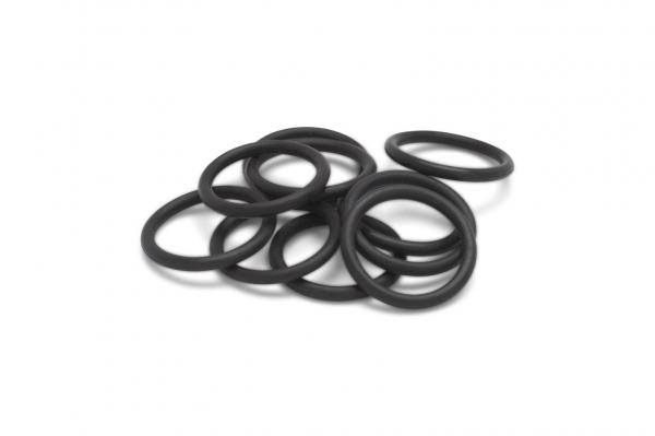 The image shows several black rubber rings stacked on top of each other. The rings have a smooth, round shape and vary slightly in position.