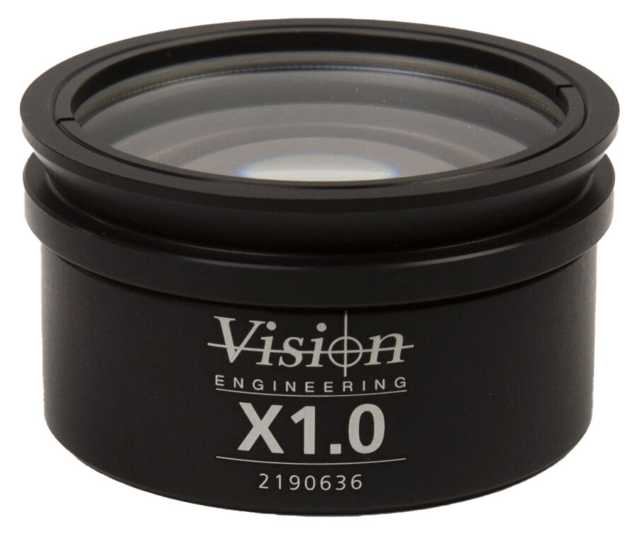 The image shows a black lens with a round shape. On the front, it has the inscription "Vision Engineering X1.0" in silver lettering. It has a smooth surface and a clear lens.