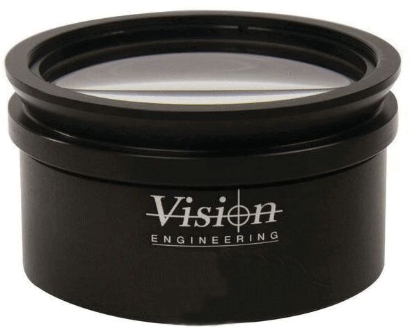 The image shows a round, black lens in a casing with a clear, curved glass cover. On the side, there is the inscription "Vision Engineering". The lens has a smooth surface.