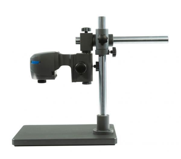 The image shows a microscopic device on a stable base. It has a long, adjustable arm with an optical system attached to it. The colors are predominantly gray and metallic.