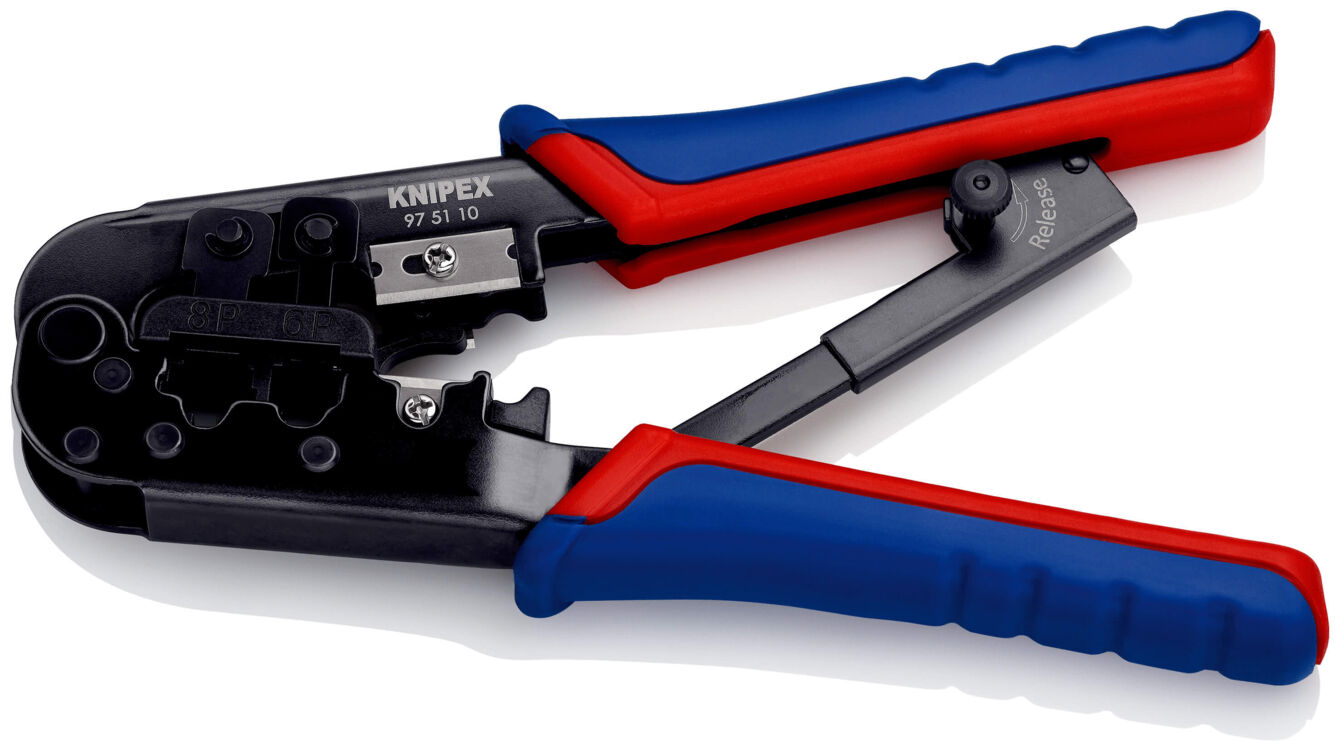 The image shows a crimping tool with black metal parts and colorful, ergonomic handles in blue and red. It is designed for connecting cables and has a compact, sturdy construction.