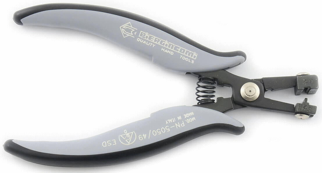 The image shows a pair of pliers with gray, ergonomic handles and a metal construction. It has a closed shape with a spring in the middle for opening and closing.