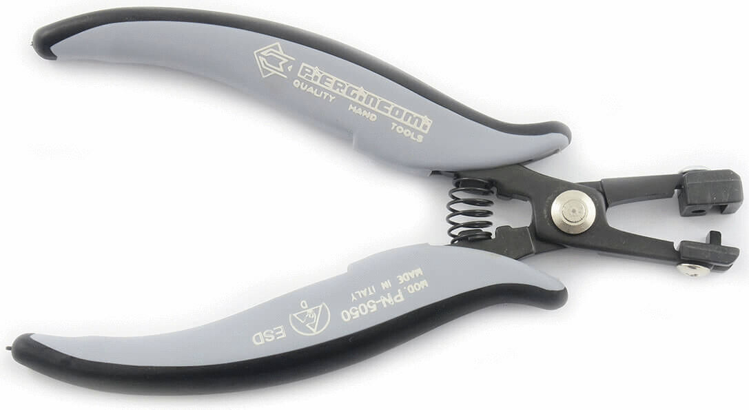 This is an ergonomic type of pliers with gray, rubberized grips. The pliers have movable jaws and a spring that facilitates opening. It is intended for precise work.