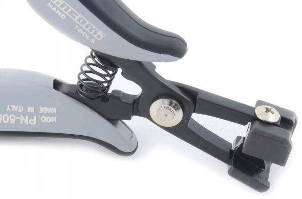 The image shows a gray pliers with a curved handle and a spring in the middle. The front part has a clamp that can open and close. The pliers appear sturdy and ergonomic.