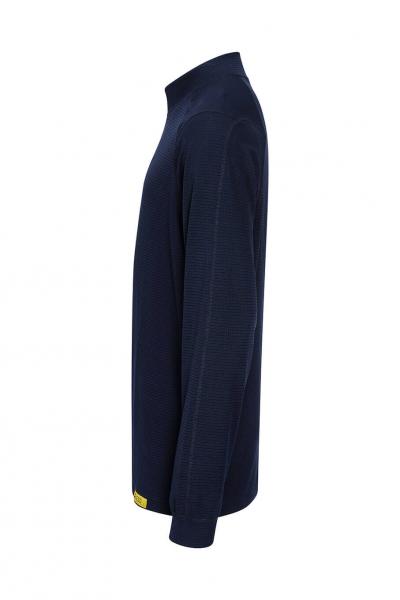 The image displays a long-sleeved, dark blue top in a side view. It features a high collar and a yellow label at the hem. The fabric appears smooth and slim-fitted.