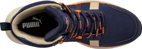 The shoe is a sports model in dark blue with orange accents. It has a lightweight, breathable surface and comfortable lacing. The sole is light beige.