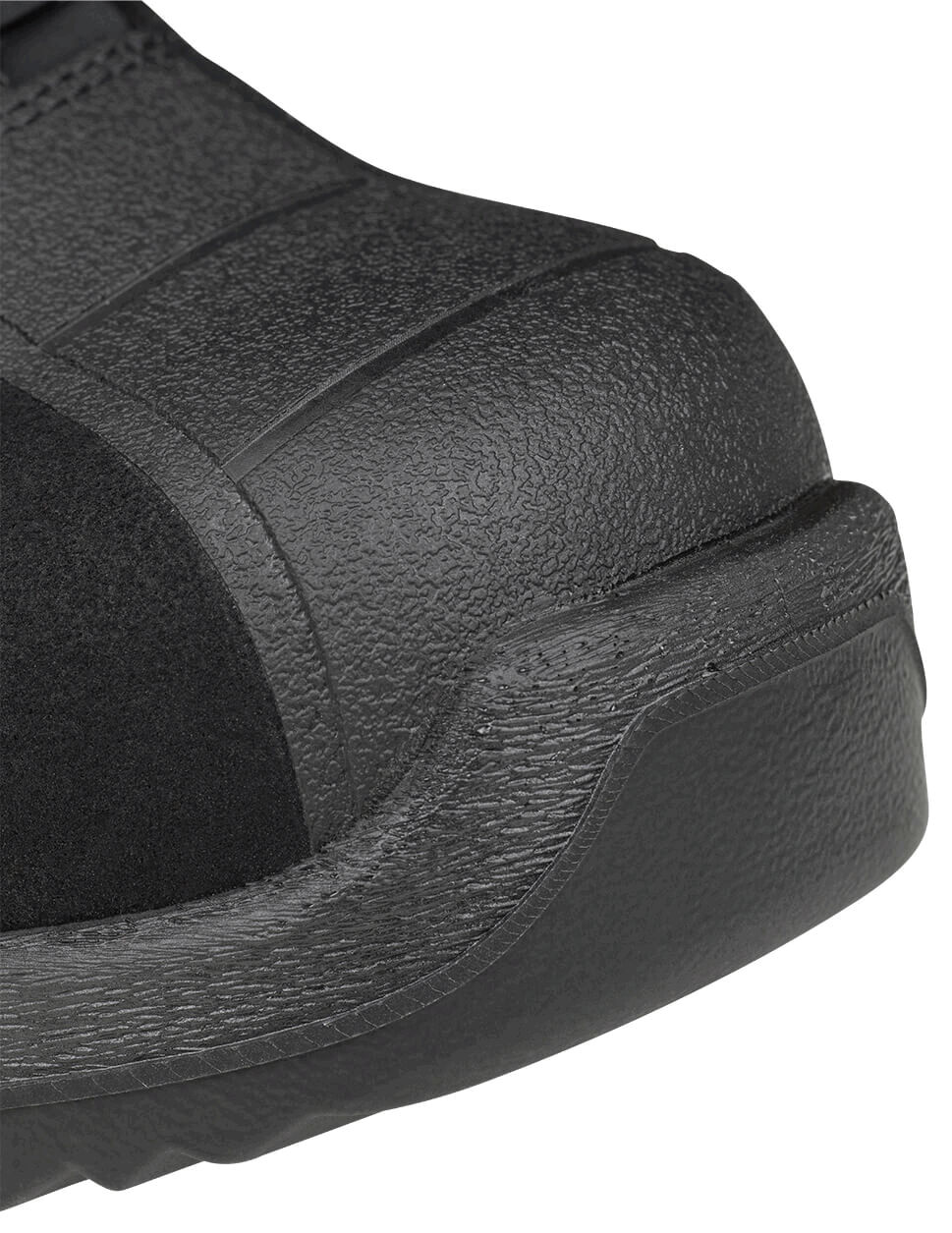 The image shows the front of a black work shoe with a reinforced toe cap. The surface is textured and partly smooth. The shoe has a sturdy, wide sole.