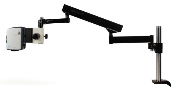 This is a technical device with a large, horizontal arm that holds a camera head. The arm is mounted on a stable base. It has a modern, functional design.