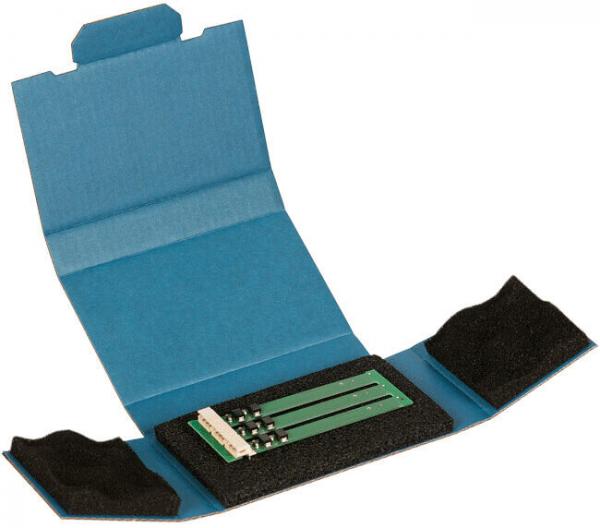 The image shows an open, blue cardboard packaging. Inside, there are three green circuit boards, surrounded by black foam. The packaging has two side flaps.