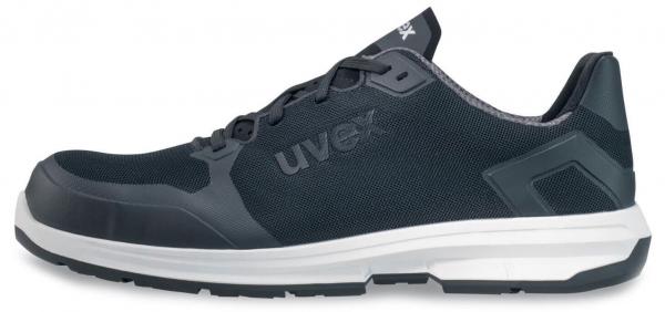 The image displays a sporty shoe in dark grey and black. It features a breathable fabric upper, a cushioned sole, and a white midsole for comfort.