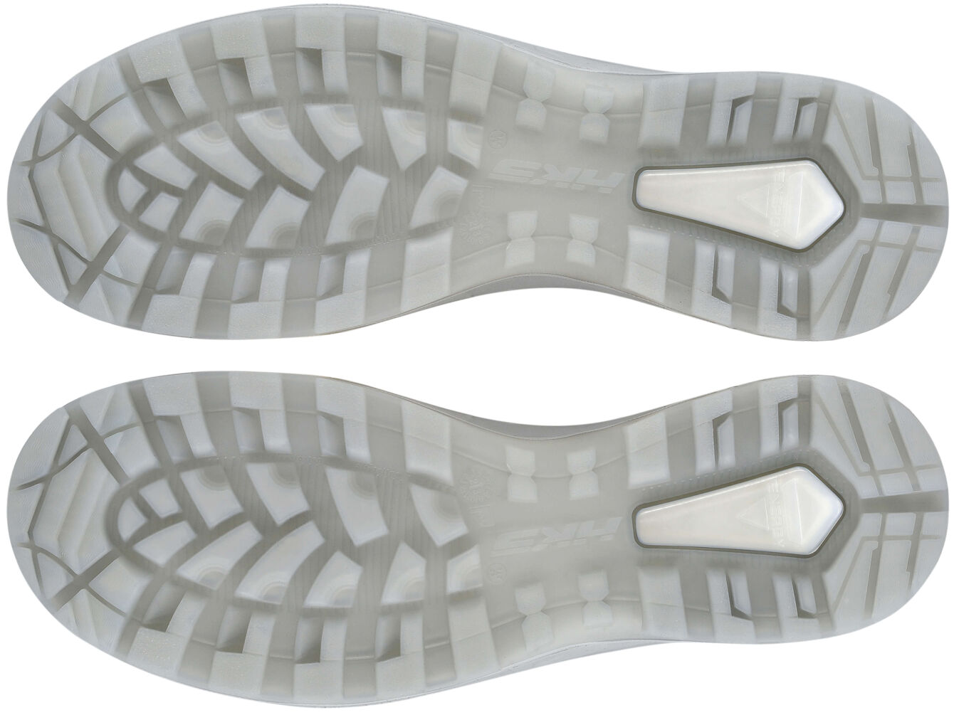 The image shows the undersides of a sports shoe. They are gray and feature a textured pattern with waves and grooves, which provides better grip and flexibility.