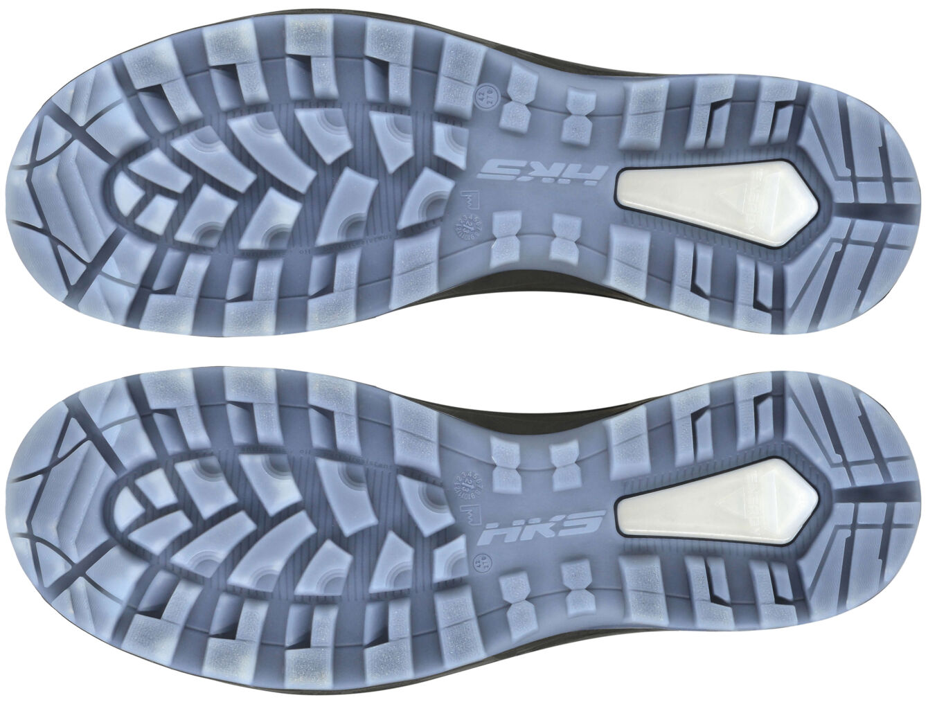 The image displays the undersides of two athletic shoes. They are made of rubber with a textured, non-slip tread. The soles are in shades of gray and feature a central elevation.