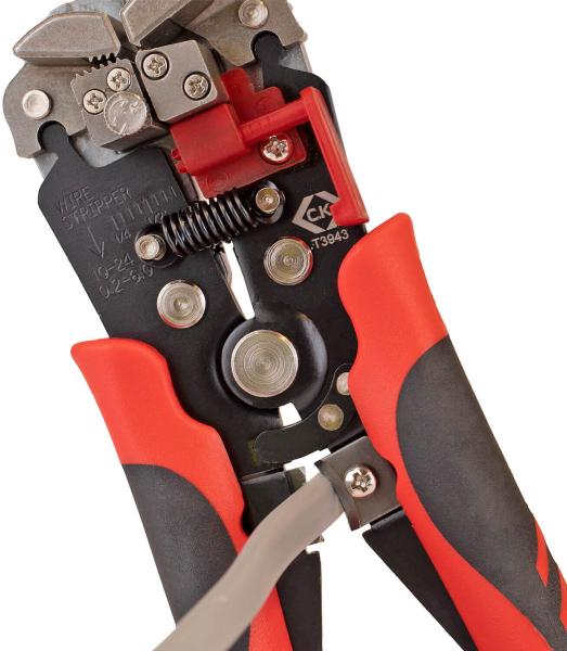 The image shows a cable cutter with red, grippy handles and a metallic upper part. The tool jaws are sharp and precisely designed, ideal for stripping cables.