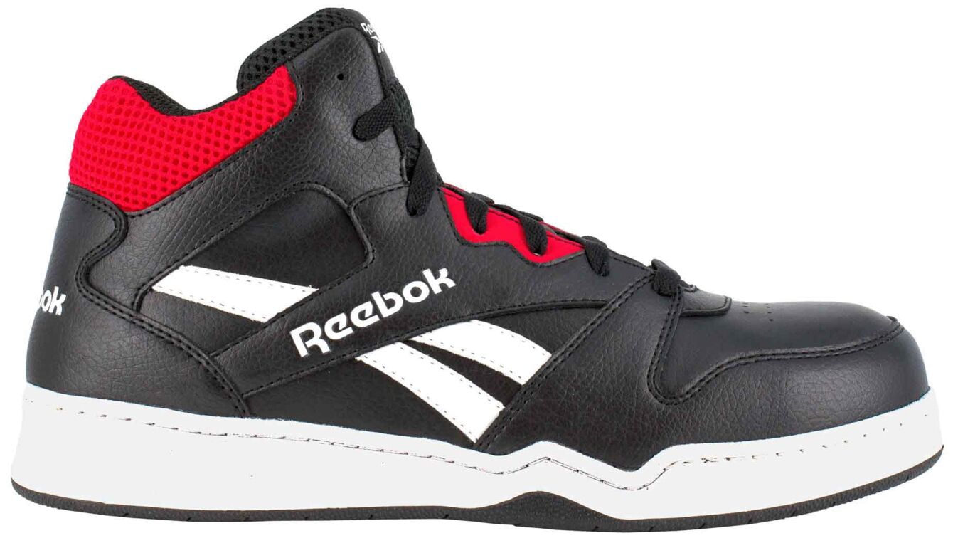 The shoe is a black, mid-top sneaker with red accents and white details. It has a smooth surface, a sturdy sole, and the brand "Reebok" is visible on the side.