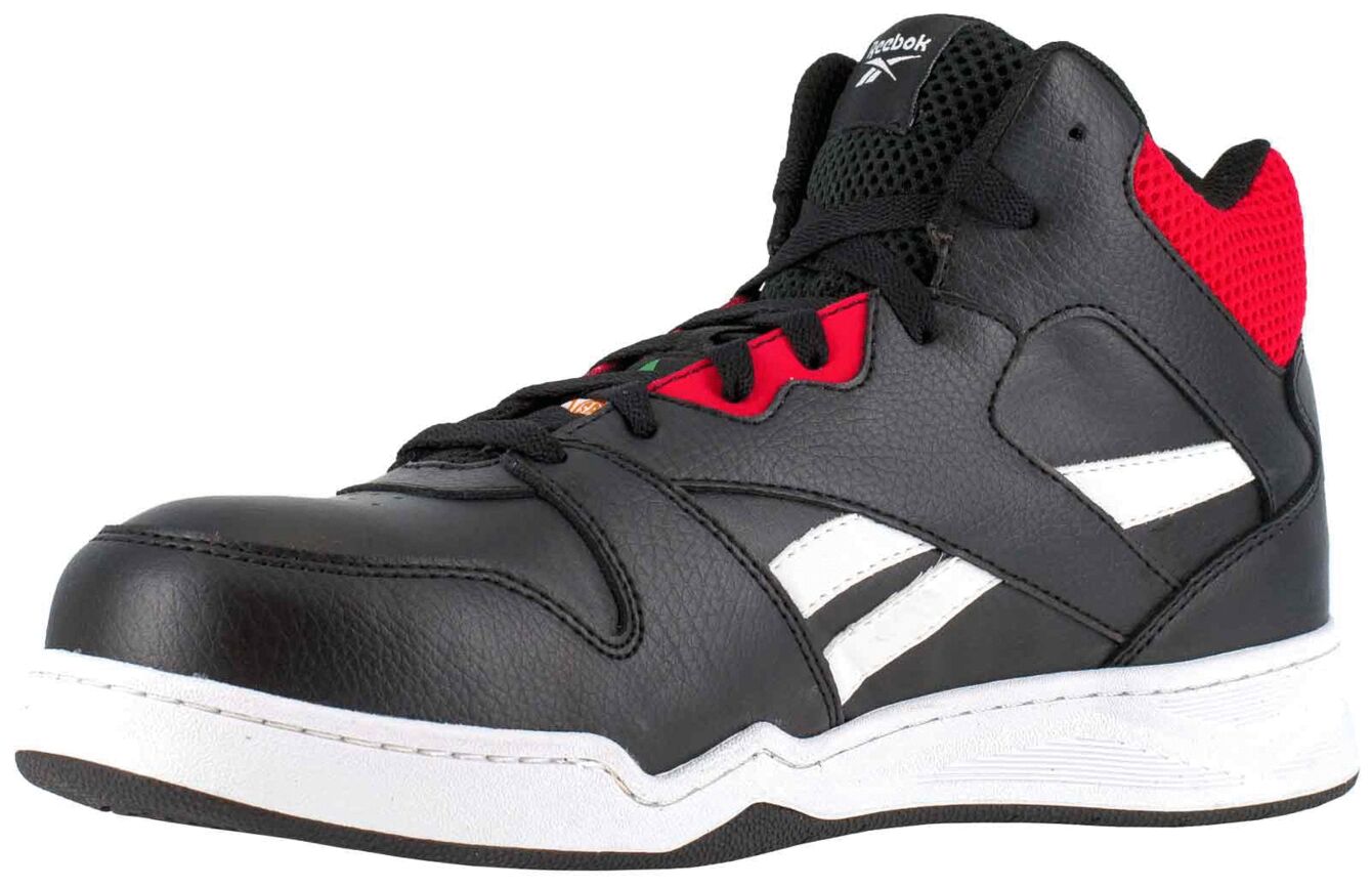 The shoe is a black basketball high-top with red and white accents. It features a thick sole, padded tongue, and a breathable upper. Sporty and stylish.