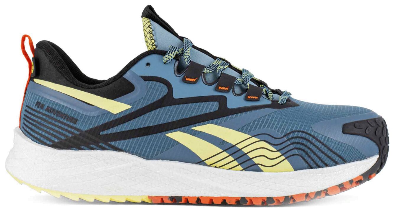 The shoe is sporty, in blue with yellow and black accents. The sole is wide and shock-absorbing, the upper features a breathable material with laces.