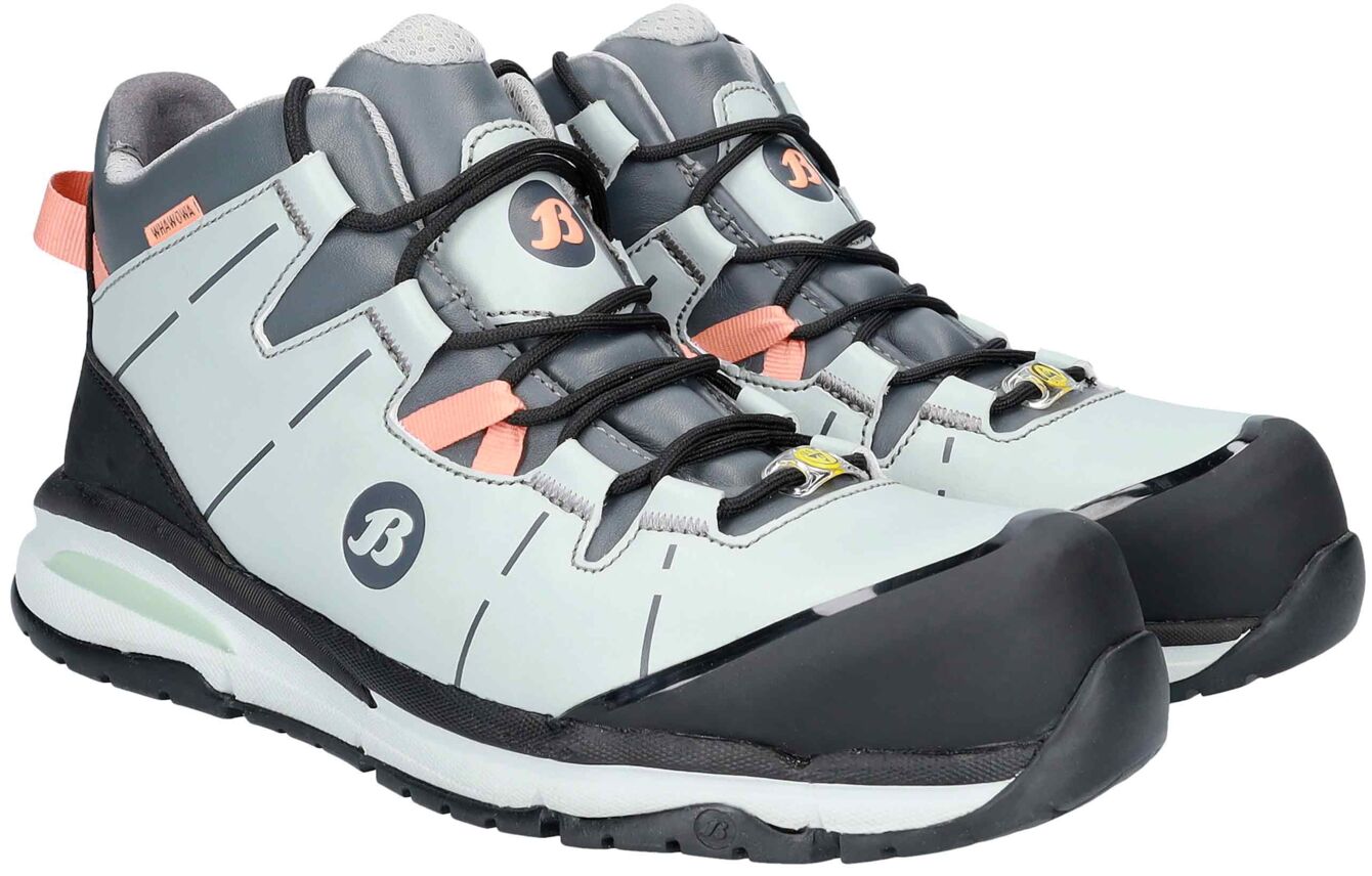 The image shows a pair of sporty shoes. They are predominantly light blue with gray and black accents. The laces are black, and there are orange details. The sole is sturdy.