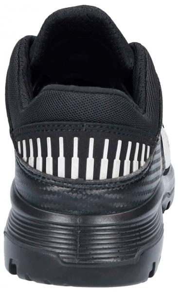 The image displays the rear view of a sports shoe. It is predominantly black with a textured upper. Vertical white stripes are placed on the heel. The shoe features a sturdy sole.