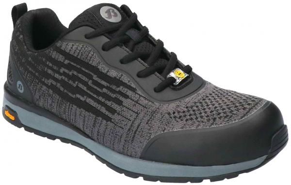 The shoe is sporty and modern, primarily in black with gray and metallic accents. It features a textured-looking surface, laces, and a sturdy, rubberized sole.