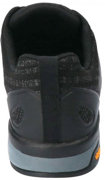 The image shows the back of a black sports shoe. The shoe has a textured textile upper, a gray sole, and colored details on the bottom. The entry is well padded.