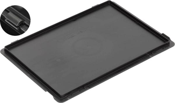 The image shows a black, flat piece of plastic, likely a container or a cover. It has a smooth surface and rounded corners. In the upper left, there is an enlarged detail of a small flap.