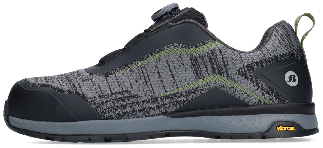 The shoe is sporty and modern, primarily in gray with black and green accents. It has a non-slip sole, a quick lacing system, and is versatile for outdoor activities.