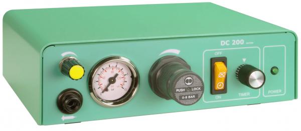 The image shows a green device with a pressure gauge, a black rotary knob, and a yellow button. It has switches for "ON/OFF", timer, and a section for pressure readings.