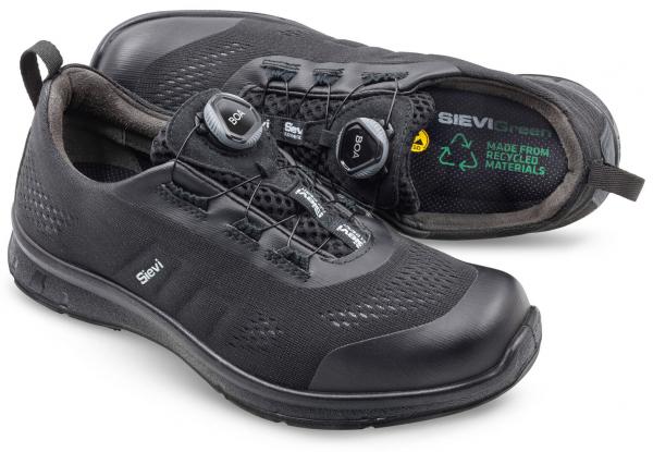 The image shows a pair of black, athletic shoes. They feature a modern design with a special lacing system attached to two solid wheels. The materials are environmentally friendly.