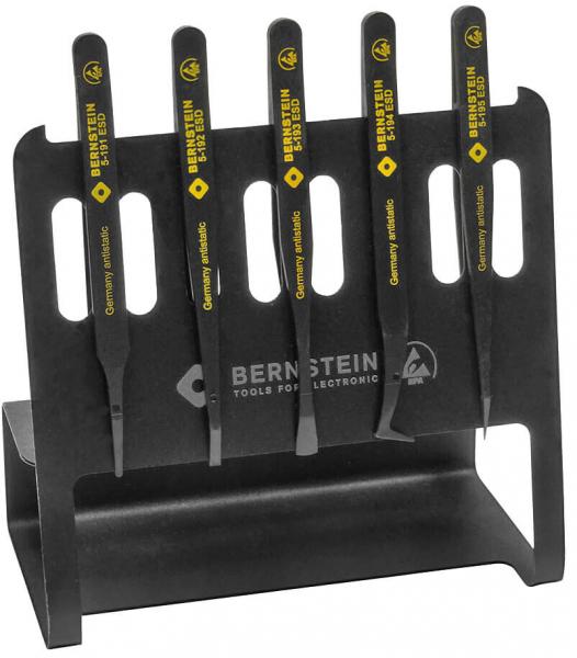 The image shows a black tool holder containing five long, narrow tools with yellow handles. The handles are labeled "BERNSTEIN", and the holder has a sturdy shape.