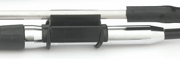 The image shows a silicone cap mounted on a metal pipe. There are shiny and matte surfaces, with a black rubber band maintaining a connection.