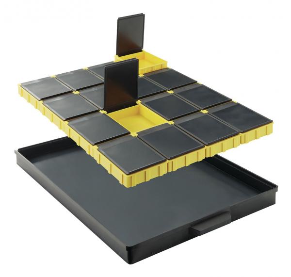 The image shows a stackable storage box. On top is a yellow, removable compartment with black sections, underneath a flat, black drawer.