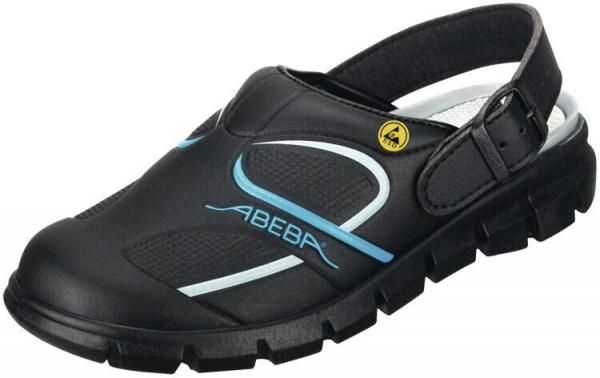 The shoe is a black sandal with a closed front and an open back. It has an adjustable strap and a grippy, textured heel. A blue logo is visible.